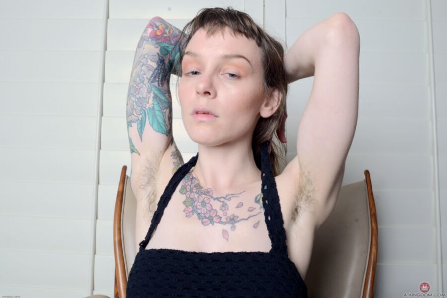 Free porn pics of Tattooed and hairy Finch gets naked on her chair. 5 of 102 pics