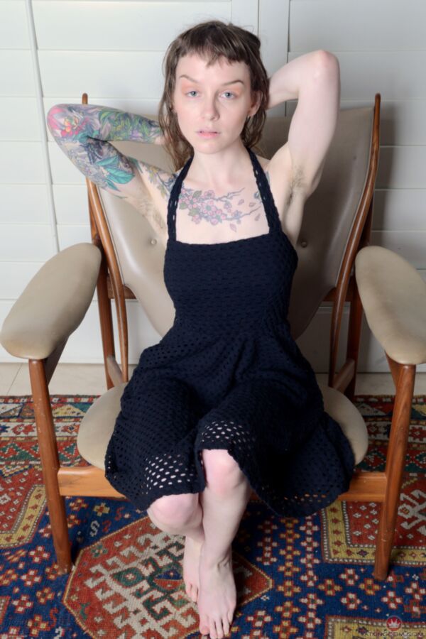 Free porn pics of Tattooed and hairy Finch gets naked on her chair. 1 of 102 pics