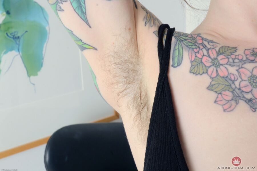 Free porn pics of Tattooed and hairy Finch bares all on her chair. 5 of 83 pics