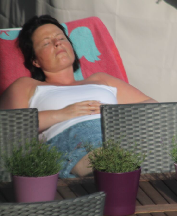 Free porn pics of Spy cam: My neighbours wife sunbathing! 8 of 8 pics