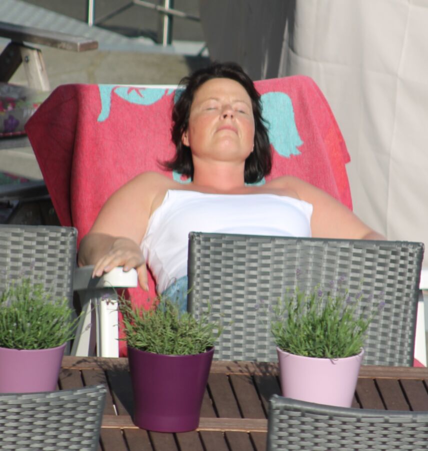 Free porn pics of Spy cam: My neighbours wife sunbathing! 1 of 8 pics