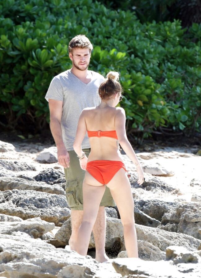 Free porn pics of Miley Cyrus - Red Bikini with Lliam Hemsworth 23 of 67 pics