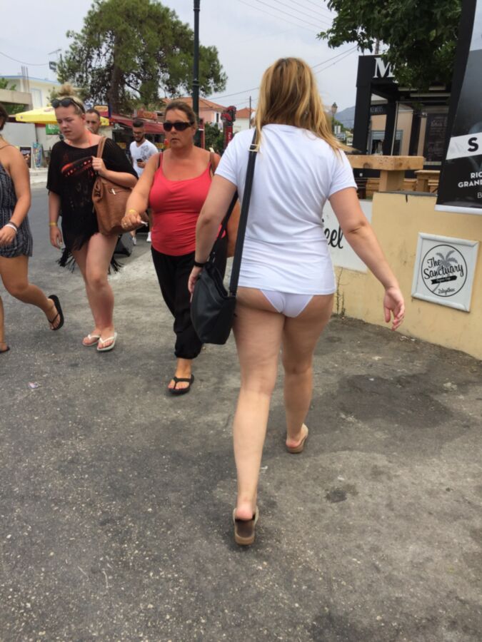 Free porn pics of Dressed only in PANTIES and short SHIRT in public street flashin 6 of 15 pics