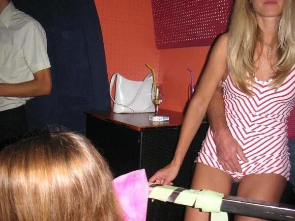 Free porn pics of Grope - women getting their pussies groped while sitting in club 19 of 54 pics