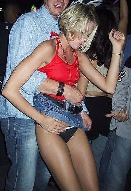Free porn pics of Grope - women caught getting their pussies groped in clubs 2 of 24 pics