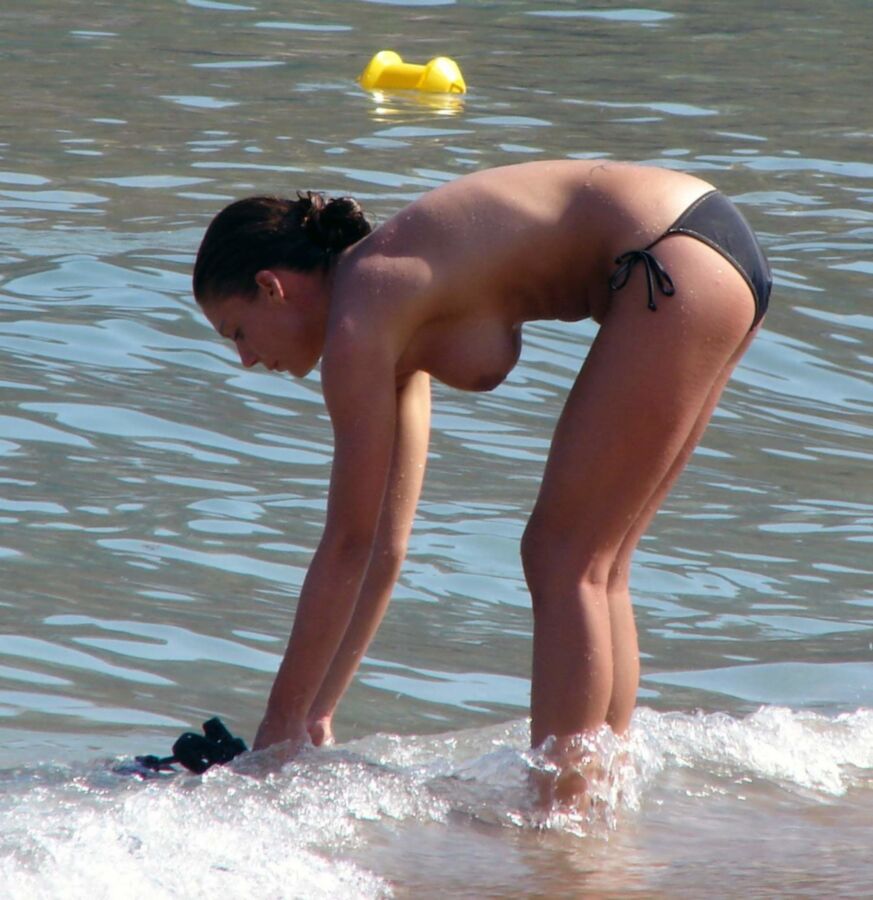 Free porn pics of Hanging Udders at the Beach 1 of 21 pics
