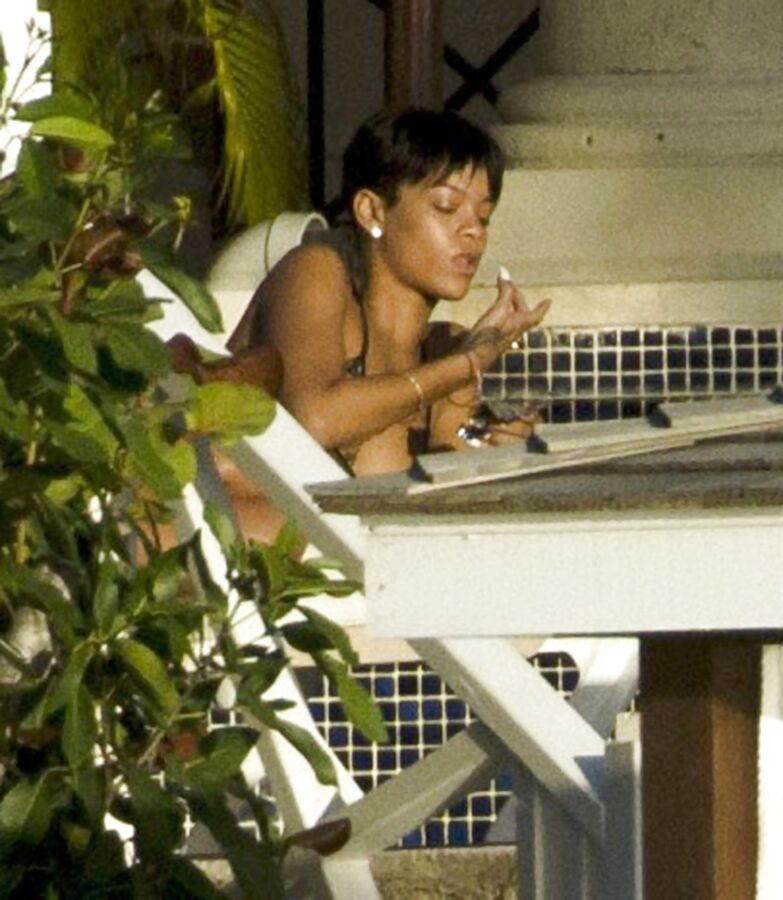 Free porn pics of my favorable singer Rihanna her smoking fetish pics having cigar 5 of 63 pics