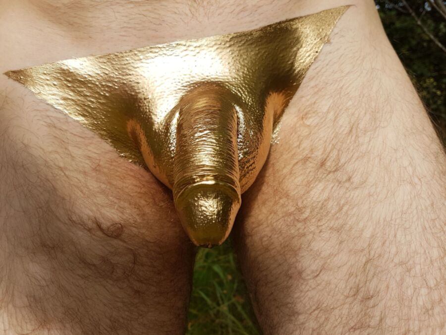 Free porn pics of Cock painting in golden metal color 7 of 13 pics