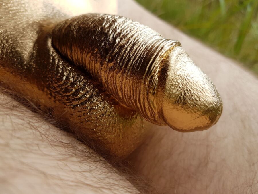 Free porn pics of Cock painting in golden metal color 3 of 13 pics