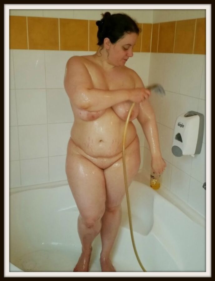 Free porn pics of Showering in bath with a showerhead 6 of 24 pics