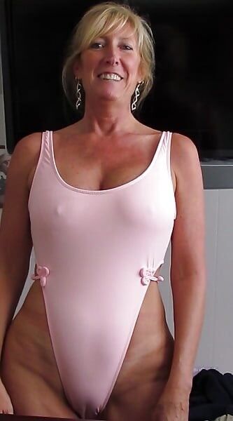 Free porn pics of Sally In Her Tight Pink Swimsuit 2 of 3 pics