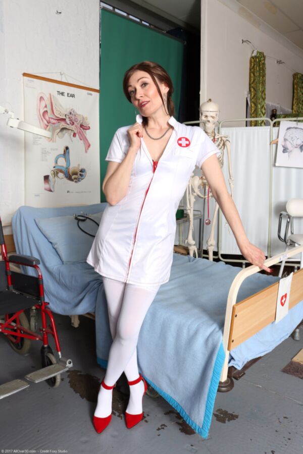 Free porn pics of Mature nurse Kitty pleasures herself on a hospital bed. 1 of 181 pics