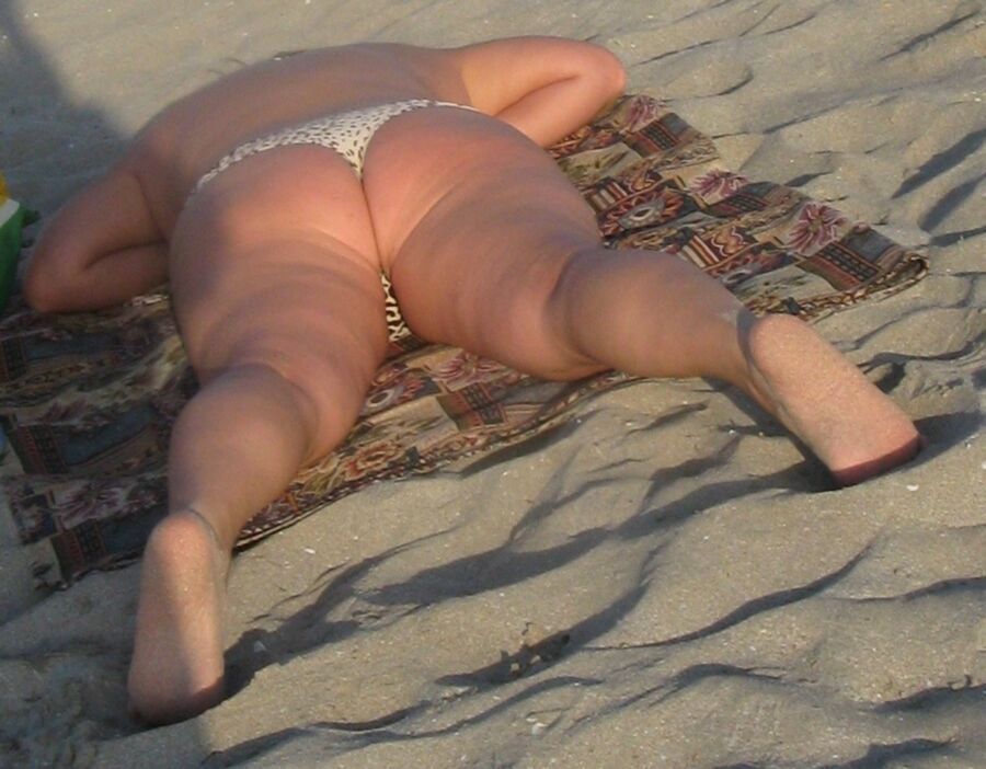 Free porn pics of Fat Ass Mom on a beach 10 of 25 pics