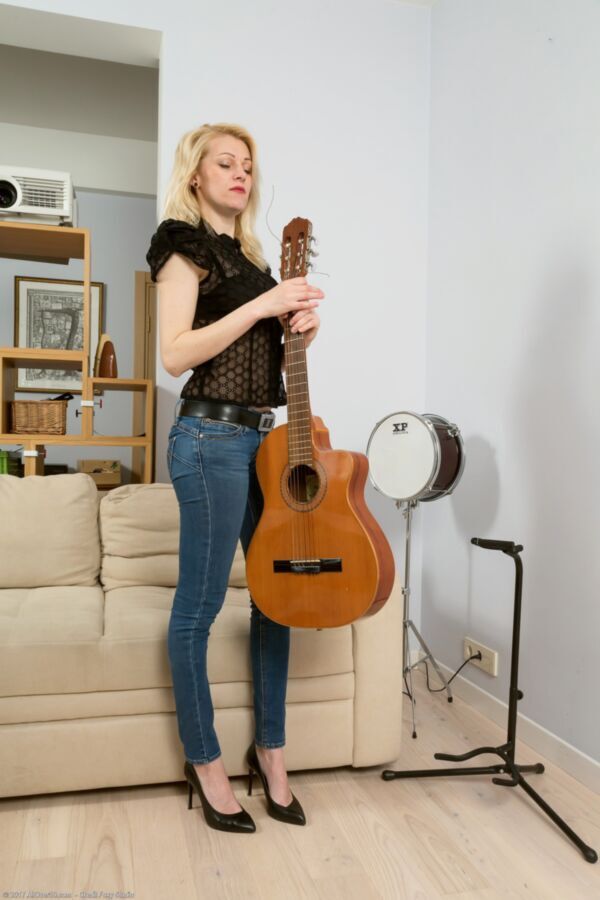 Free porn pics of Mature blond Sasha puts down her guitar and strips. 6 of 142 pics