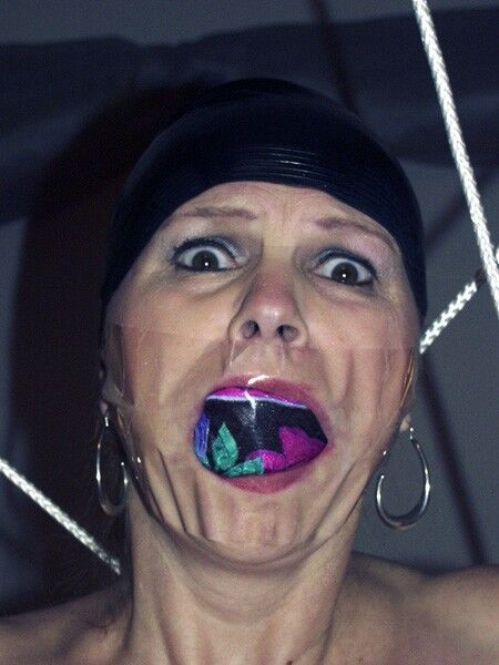Free porn pics of Panties In Her Mouth With Swim Cap 2 of 3 pics