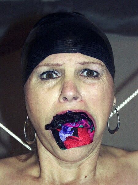 Free porn pics of Panties In Her Mouth With Swim Cap 1 of 3 pics