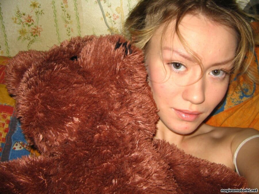Free porn pics of Hot teen girl striptease with plush teddy bear 1 of 18 pics