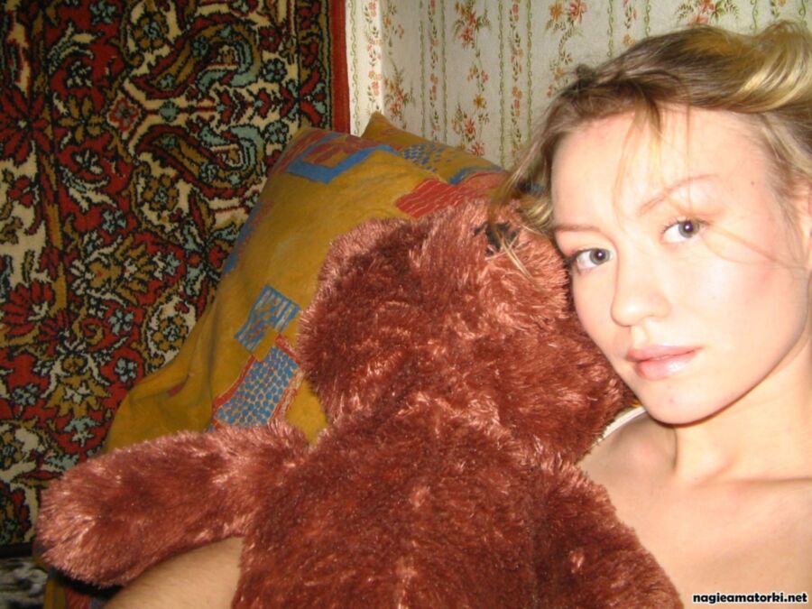 Free porn pics of Hot teen girl striptease with plush teddy bear 12 of 18 pics