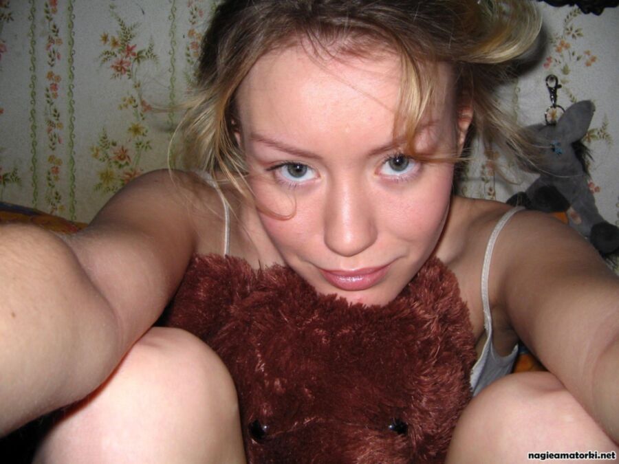 Free porn pics of Hot teen girl striptease with plush teddy bear 18 of 18 pics