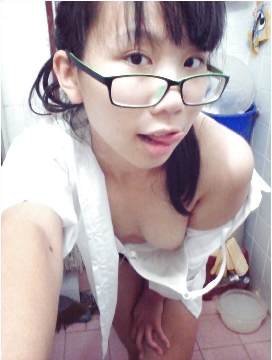 Free porn pics of Nerdy Glasses Teen Strips in Bathroom 21 of 64 pics