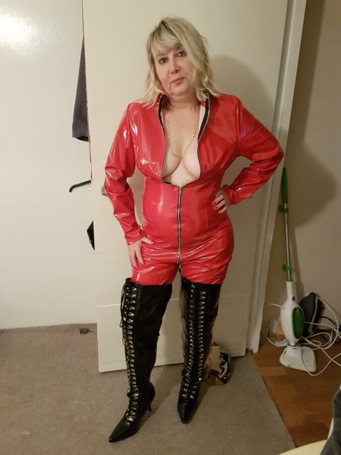 Free porn pics of Red Catsuit & Thighboots 1 of 9 pics