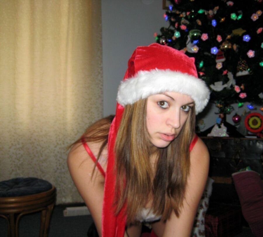 Free porn pics of Hot busty brunette strips off her naughty Santa 3 of 56 pics