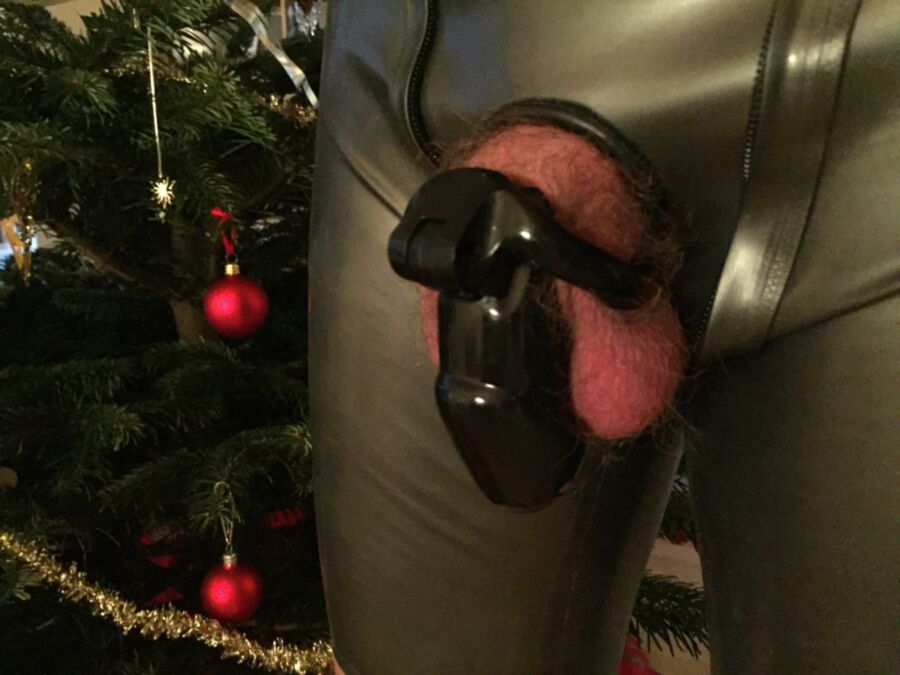 Free porn pics of Christmas in latex and chastity 4 of 5 pics
