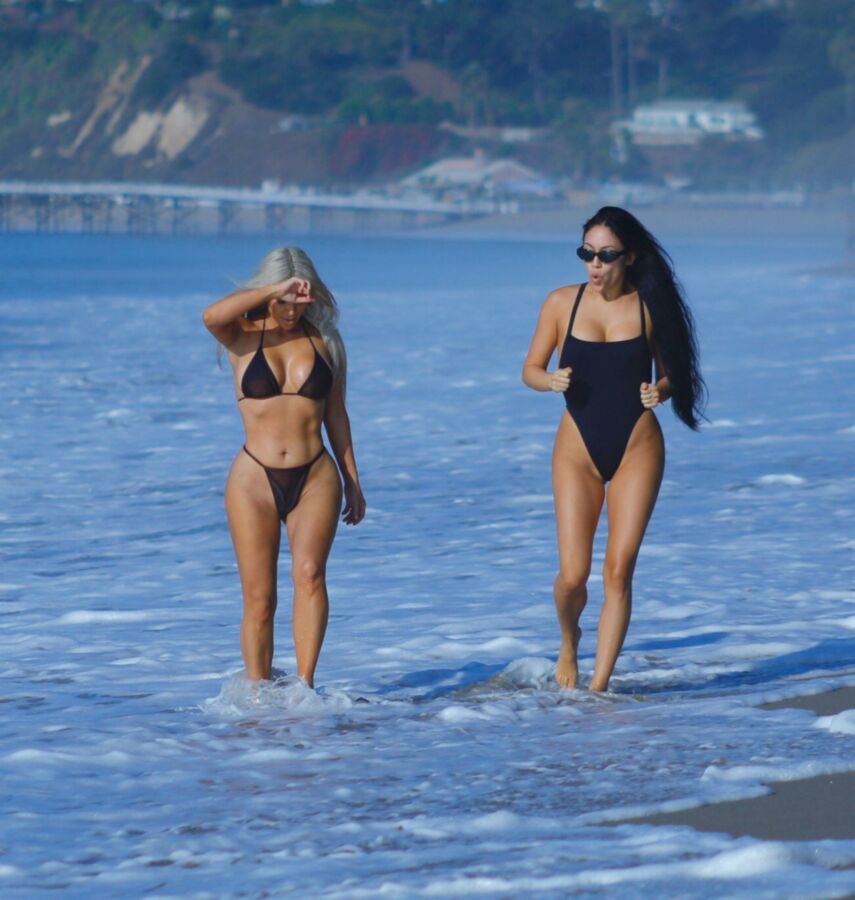Free porn pics of Kim Kardashian in a thong-bikini @ the beach 1 of 11 pics