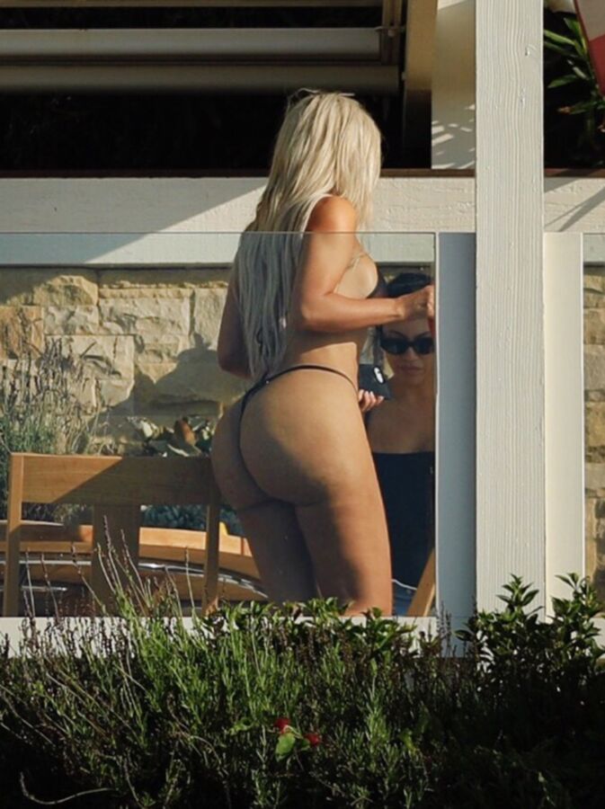 Free porn pics of Kim Kardashian in a thong-bikini @ the beach 7 of 11 pics