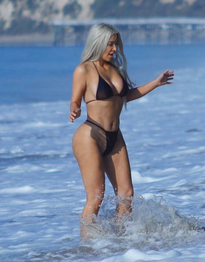 Free porn pics of Kim Kardashian in a thong-bikini @ the beach 10 of 11 pics