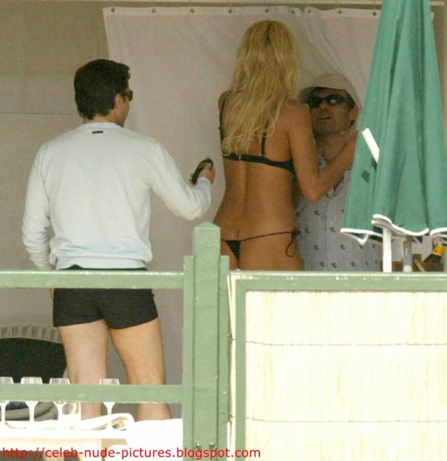 Free porn pics of Victoria Silvstedt topless sunbathing 11 of 13 pics