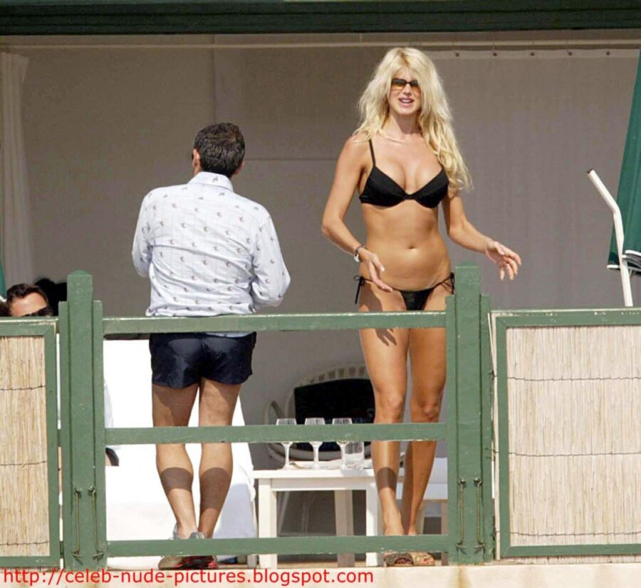 Free porn pics of Victoria Silvstedt topless sunbathing 1 of 13 pics