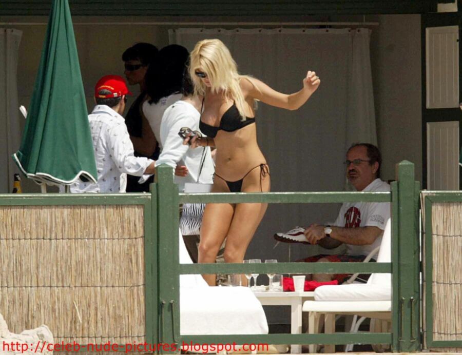 Free porn pics of Victoria Silvstedt topless sunbathing 2 of 13 pics