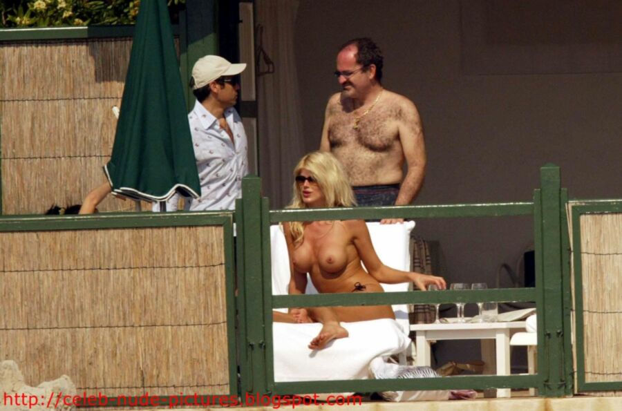 Free porn pics of Victoria Silvstedt topless sunbathing 4 of 13 pics