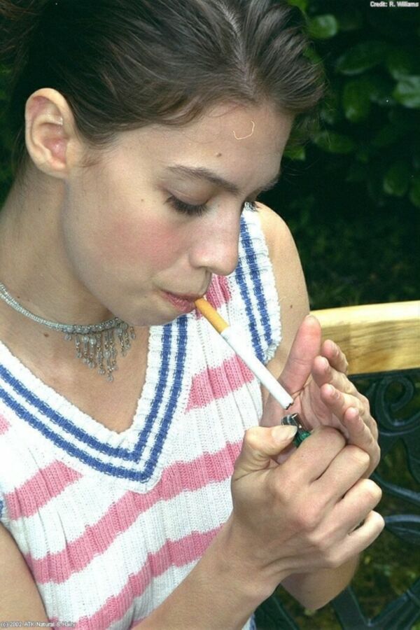 Free porn pics of Carmen smoking on bench 2 of 72 pics