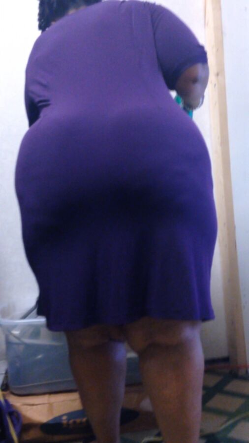 Free porn pics of Enormous BBW Ebony Ass in Purple Dress 19 of 29 pics
