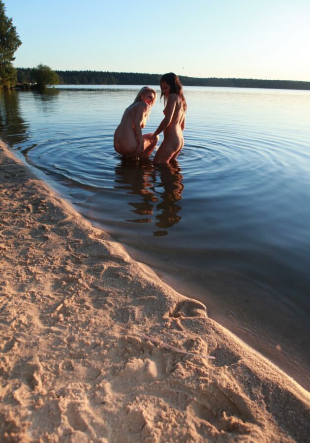 Free porn pics of Two teen nudists having fun together at the lake 1 of 185 pics