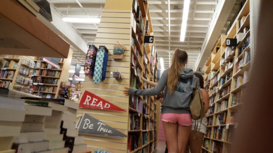 Free porn pics of SExy white girl in book store wearing some sexy pink shorts 2 of 6 pics