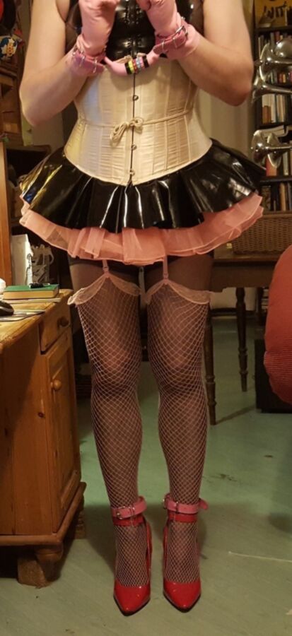 Free porn pics of Sissy Maid does chores in shiny outfit. 1 of 9 pics