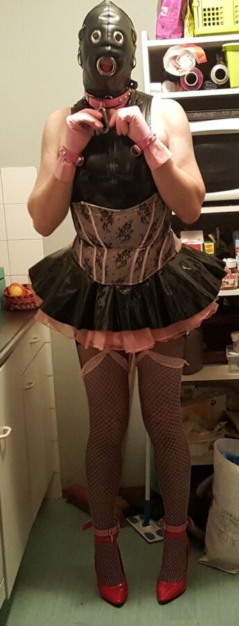 Free porn pics of Sissy Maid does chores in shiny outfit. 9 of 9 pics