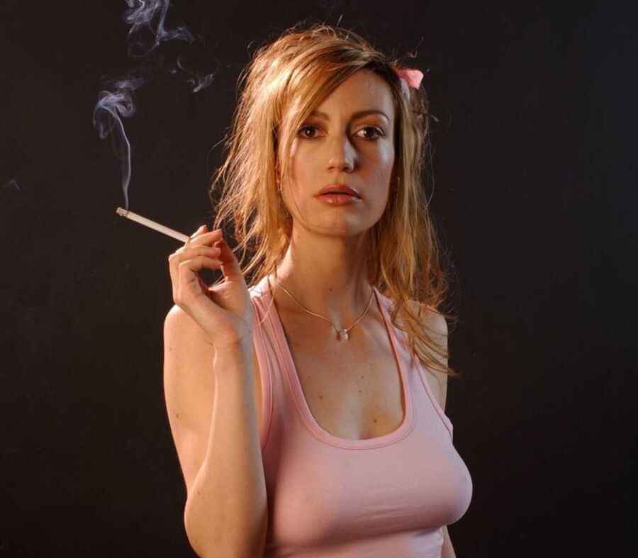 Free porn pics of Beautiful sexy redhead smoking cigarettes. 3 of 5 pics