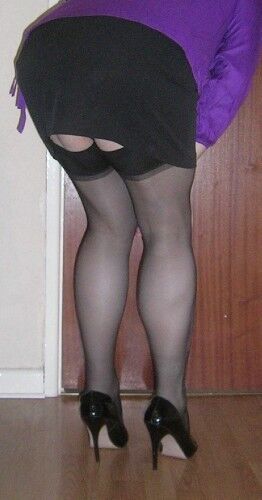 Free porn pics of Crossdressed showing Stocking Tops 5 of 14 pics