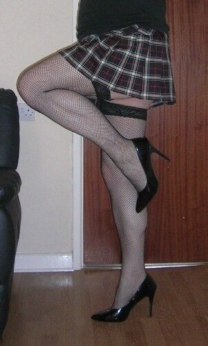 Free porn pics of Crossdressed showing Stocking Tops 3 of 14 pics