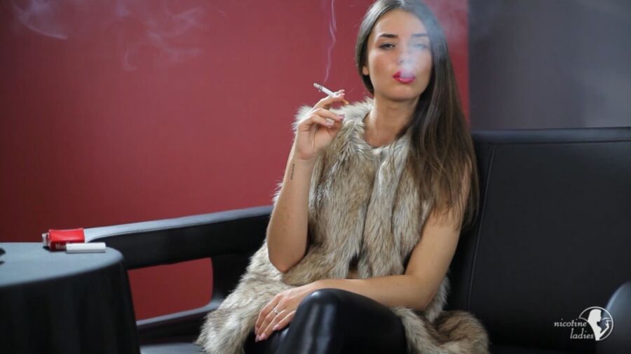 Free porn pics of Stunning brunette smoking a cigarette. 6 of 10 pics