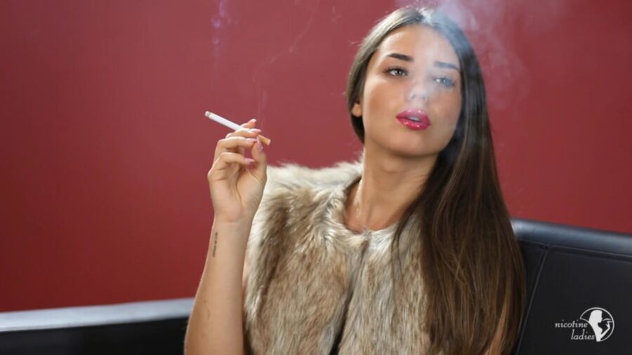 Free porn pics of Stunning brunette smoking a cigarette. 8 of 10 pics