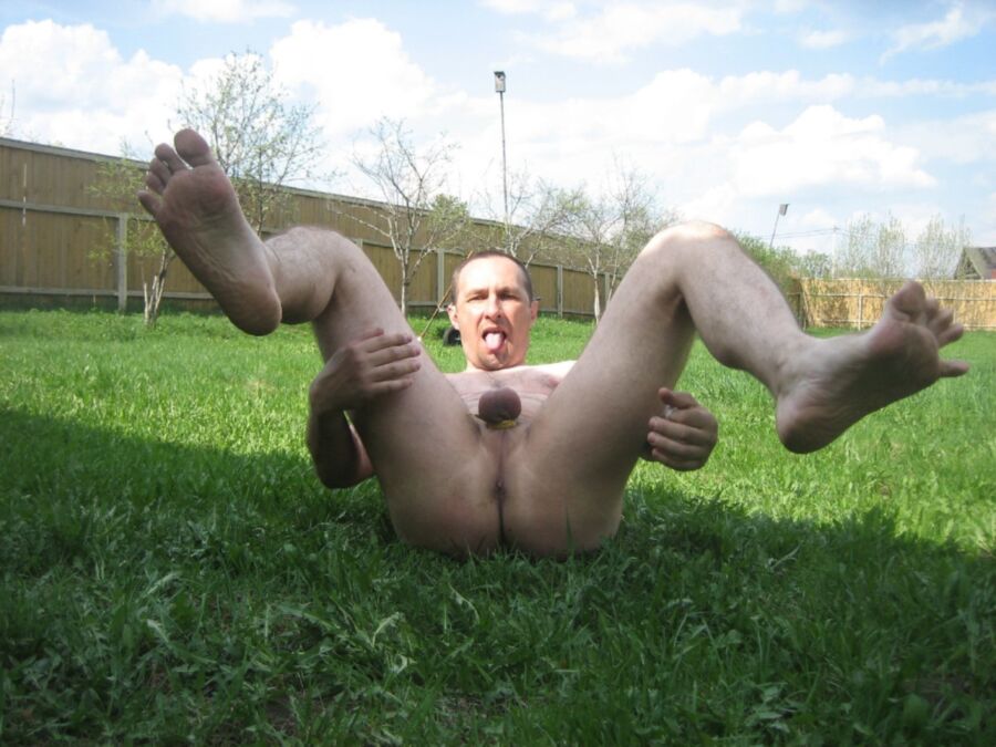 Free porn pics of Russian gay slut lying on the grass 8 of 11 pics