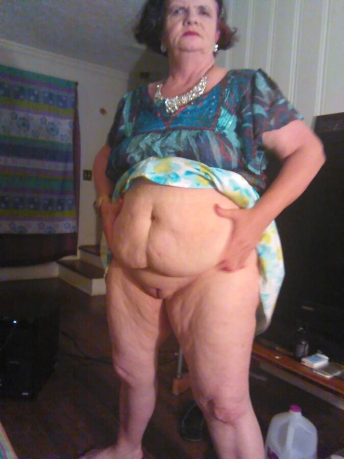 Free porn pics of Stern looking fat granny displays her cunt 1 of 10 pics