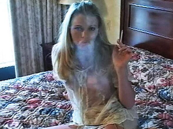 Free porn pics of here me on my bed having Marlboro red showing my pussy 1 of 28 pics