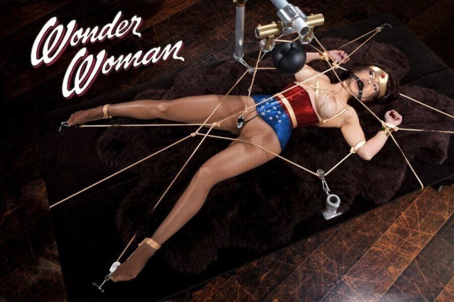 Selena Gomez as heroine wonder woman helplessly bound and gagged. 