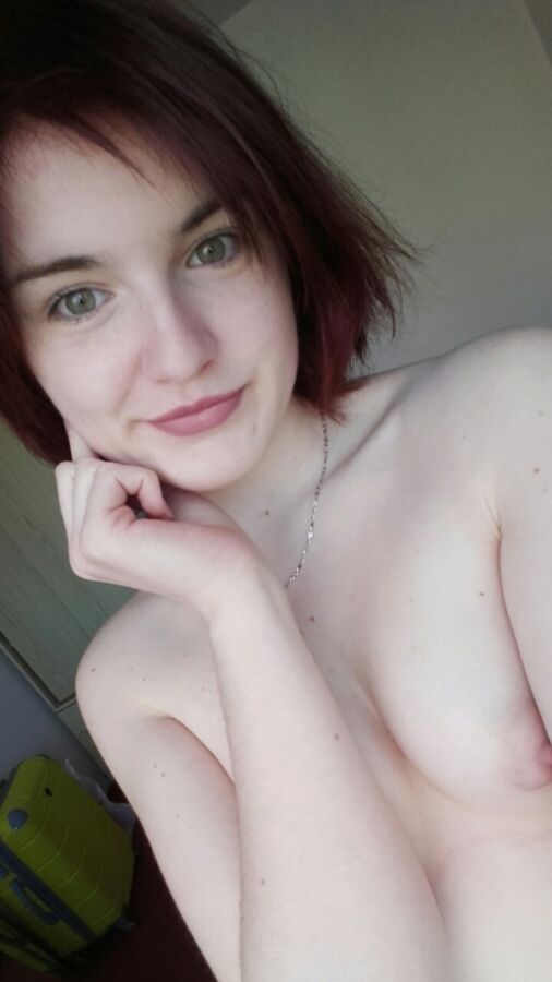 Free porn pics of Hot redhead teen showing her titties 15 of 17 pics